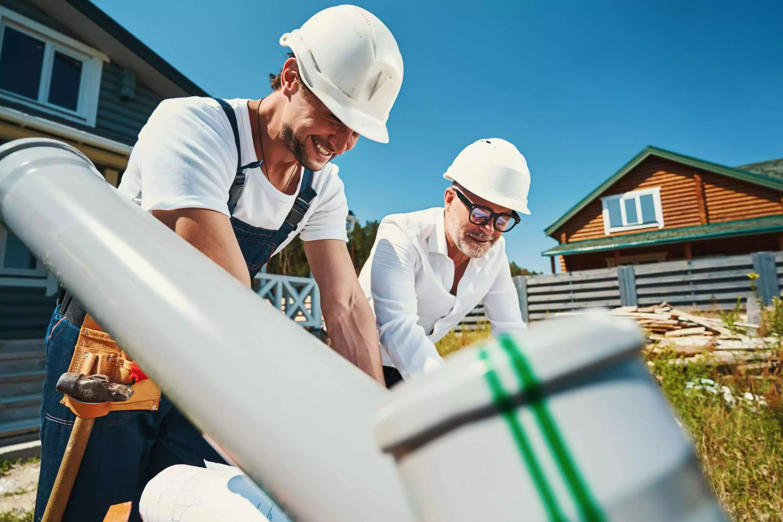 Construction Workers Collaborate on Building Project Outdoors